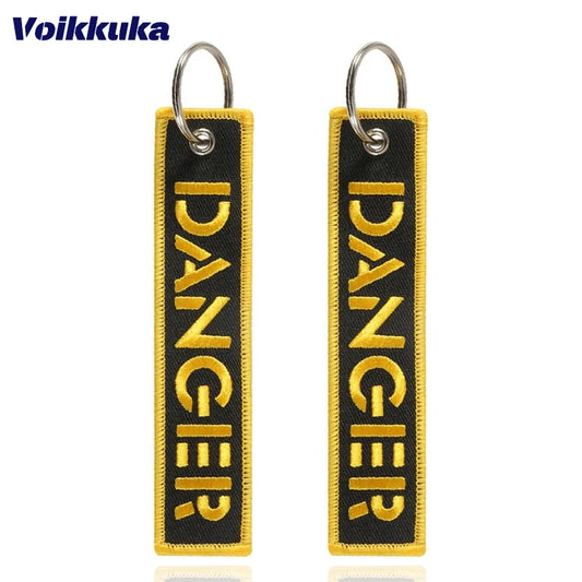 1PC 2PCS 3PCS Set Sale Golden Warning Golden Danger Both Sides Embroidery Black Cloth Tag Keychain Motorcycle Key Accessories